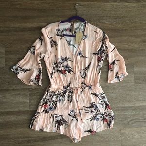 Blush v-neck floral romper with drawstring